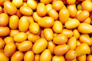 Closeup for ripe kumquat fruit texture background