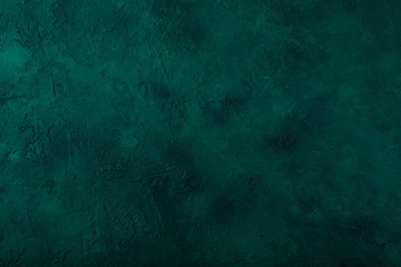 Dark green stone background. Top view. Copy space
