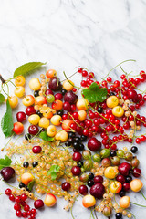 Fresh berries on a marble. Copy space. Top view