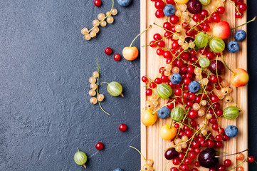 Fresh berries on board. Top view. Copy space.