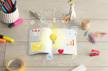 Open notebook on the floor with instruments nearby