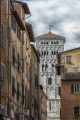 Fototapeta premium Detail of the bell tower of Saint Michael's cathedral (Italy-Tuscany-Lucca)