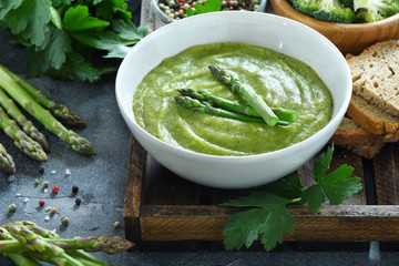 Green vegetable cream soup, with asparagus, vegan, vegetarian eating, dieting, healthy food
