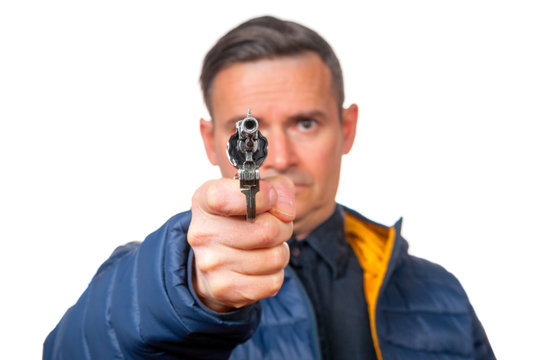Man aiming handgun on white background. Front focus