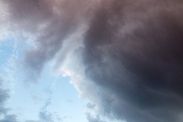 Beautiful clouds at sunset after rain as background .