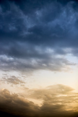 Beautiful clouds at sunset after rain as background .