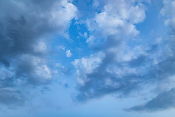 Beautiful clouds at sunset after rain as background .