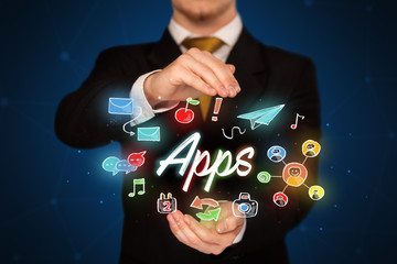 Businessman holding apps