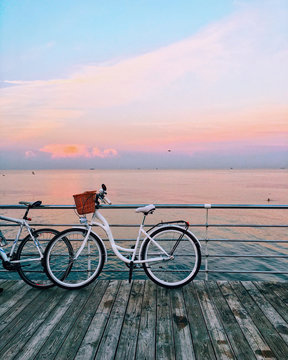 vintage bicycle on beach over blue sea and clear blue sky background, spring or summer holiday vacation concept.