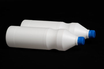 Two white plastic bottles