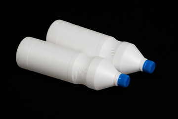 Two white plastic bottles