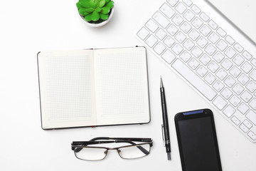 open daily, a computer and a smartphone on the desktop in the office