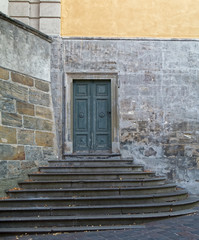 Fototapeta na wymiar Old, wooden door in the side wall of the castle.