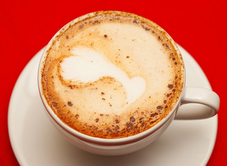 A cup of cappuccino on the table
