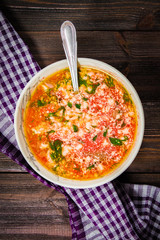 Traditional Ukrainian Russian vegetable borscht on the white wooden background. Top view