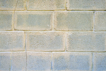 Fototapeta premium Cinder block wall with cracks