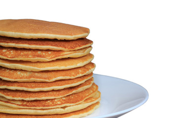 Closed up stack of fresh homemade plain pancakes served on plate, white background with free space for text or design 