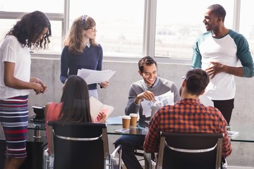 Business colleagues discussing at desk