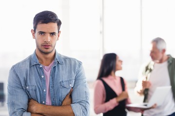 Portrait of businessman with arms crossed