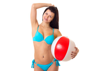 Woman in swimming suit with ball