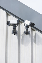 CCTV cameras on the side of a building.
