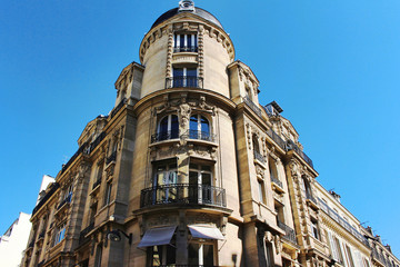 Fototapeta na wymiar View on white corner building wall with blue sky, paris city, france