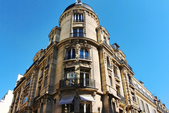View on white corner building wall with blue sky, paris city, france