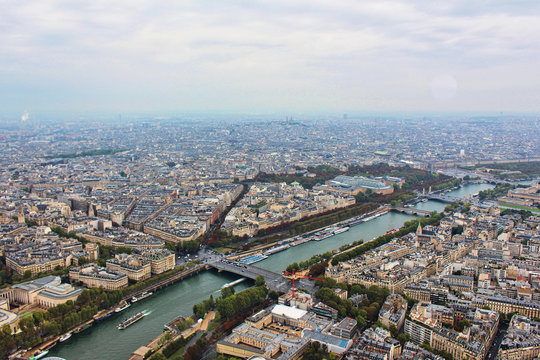 Panoramic view on paris city, seine river and grand palais, from the top of eiffel tower, france