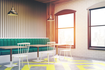 Corner of cafe with posters, gray, toned