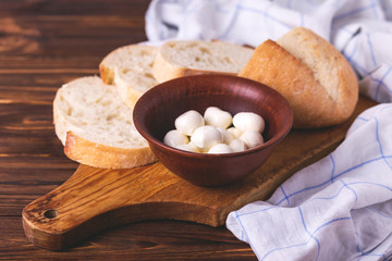 Fototapeta na wymiar Sliced wheat bread and mozzarella. Healthy food