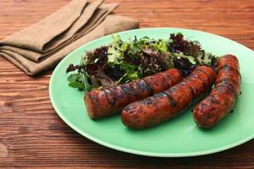 Grilled sausages with greens