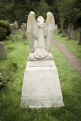 Rear view of angel themed tombstone.