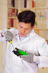 closeup shot young male technician repairing a toner using a screwdriver