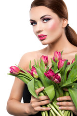 Beautiful woman with tulips on a white background