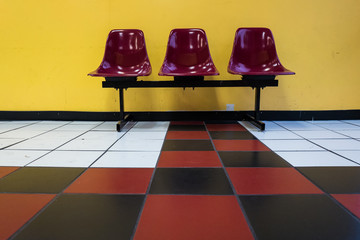 Chairs in a Red and Yellow Checkerboard Waiting Room