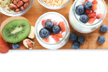 Composition with tasty yogurt on white background