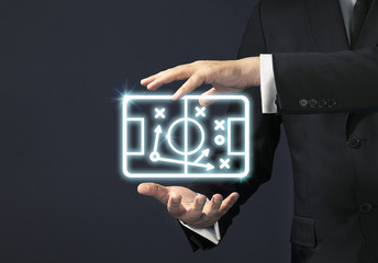 Businessman magical touch concept -  football tactic