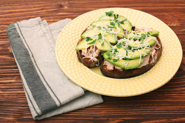 Open avocado sandwiches with tuna on whole grain bread