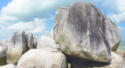 Natural rock formation on a white sand beach in Belitung Island in the afternoon, Indonesia.