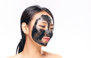 woman with black mask, exfoliation, cleansing