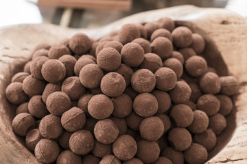 Bowl of chocolate sweets on display.