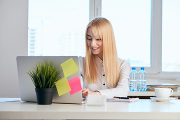 beautiful blonde, business lady with laptop, office