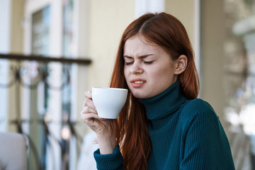 woman with a mug of tea, coffee, emotions