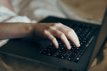typing on keyboard, laptop, hand