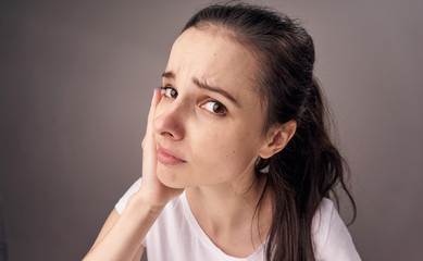 frustrated woman on a brown background