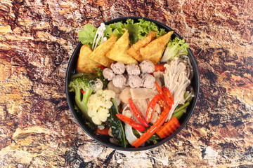 Crisy wonton and meat ball in Chinese kale soup .