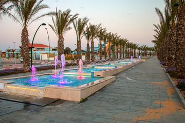 Ashkelon seaside park fountains colored evening light
