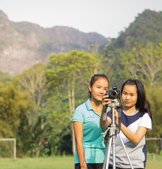 Asian girls are having fun with photography.