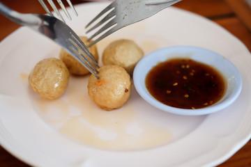 Fish meatballs with sauce