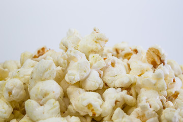 Fototapeta na wymiar Popcorn in white bowl closeup image white background